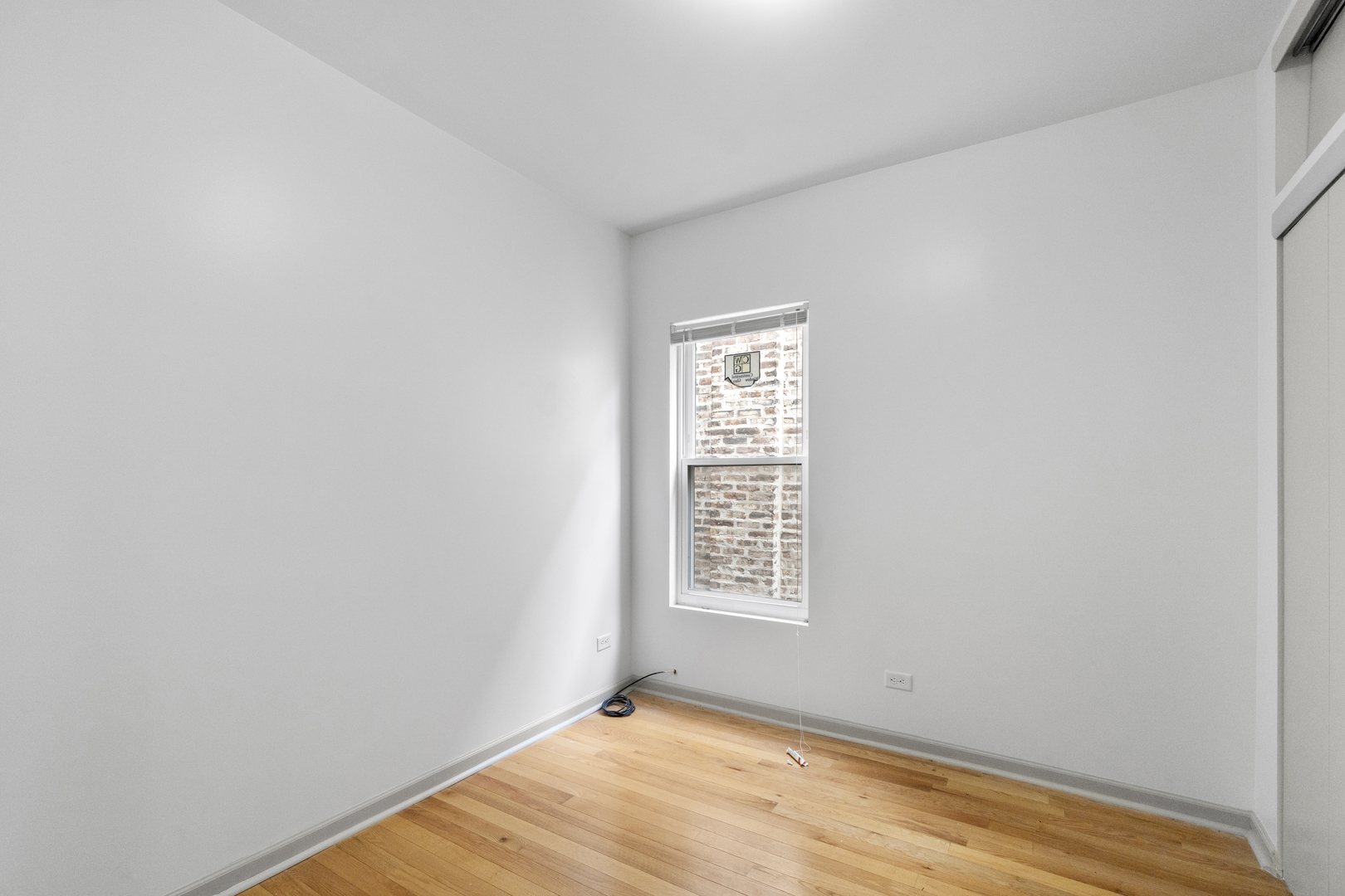 7223 North Damen Avenue Chicago, IL 60645 - Photo 28 of 37 a view of an empty room with a window