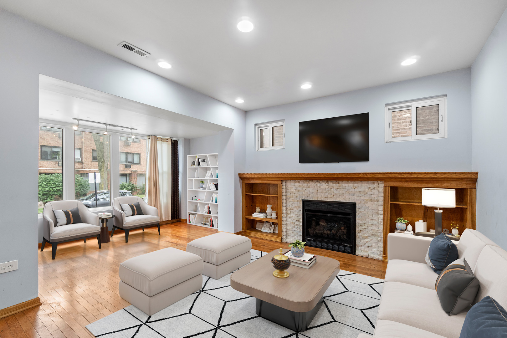 7223 North Damen Avenue Chicago, IL 60645 - Photo 5 of 37 a living room with furniture a fireplace and a flat screen tv