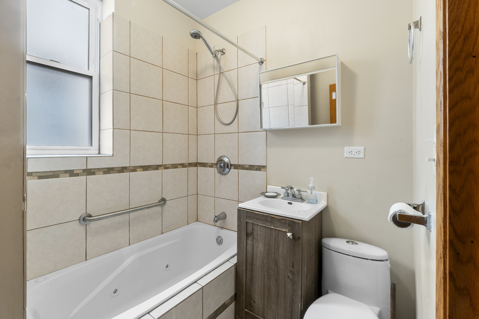 7223 North Damen Avenue Chicago, IL 60645 - Photo 8 of 37 a bathroom with a sink toilet and shower