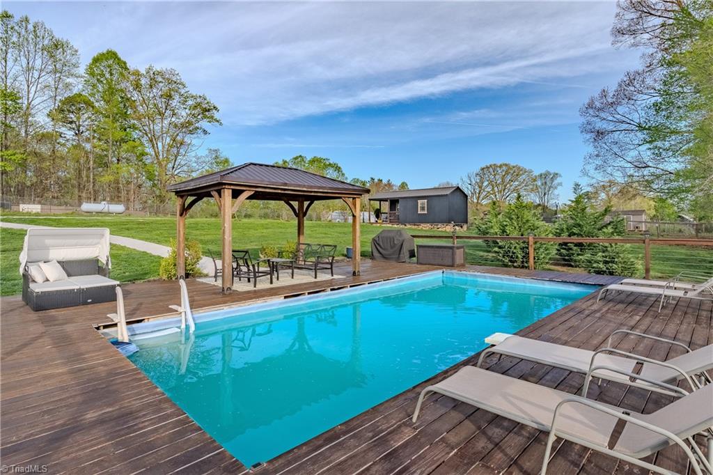 1009 Ray Loop Road Westfield, NC 27053 - Photo 12 of 45 Perfect timing to open the pool up for the season and enjoy those hot summer days that are coming (did I mention there is a half bath in the bunk house to the right of the gazebo)