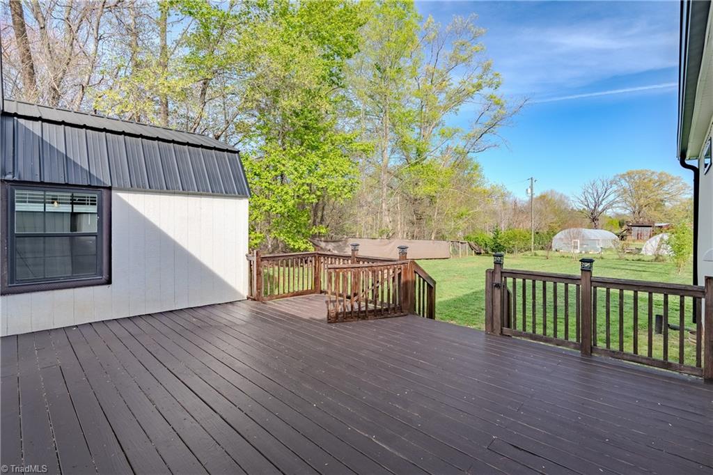 1009 Ray Loop Road Westfield, NC 27053 - Photo 35 of 45 Deck overlooking mini orchard of apple, pear and peach trees/ 2 green houses and a barn and a chicken coup