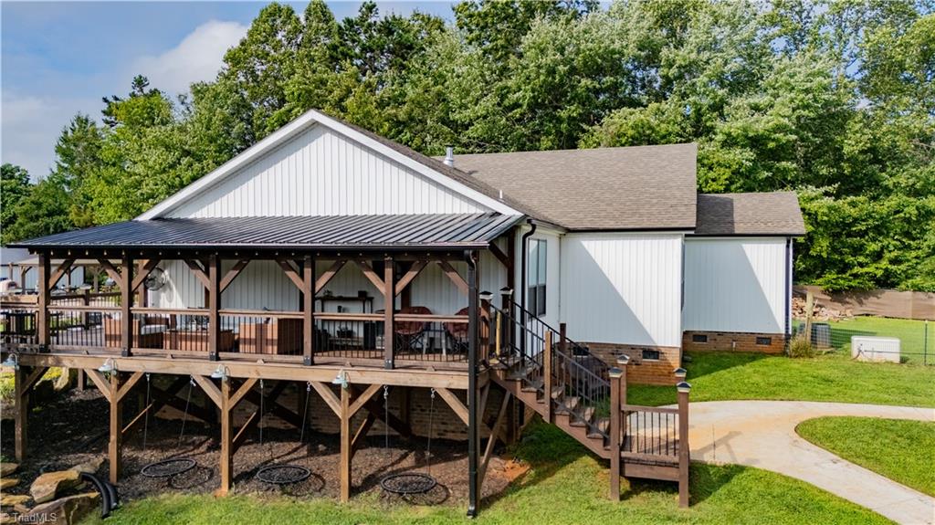 1009 Ray Loop Road Westfield, NC 27053 - Photo 10 of 45 Great covered porch to hang that big screen and watch the games while enjoying the great outdoors