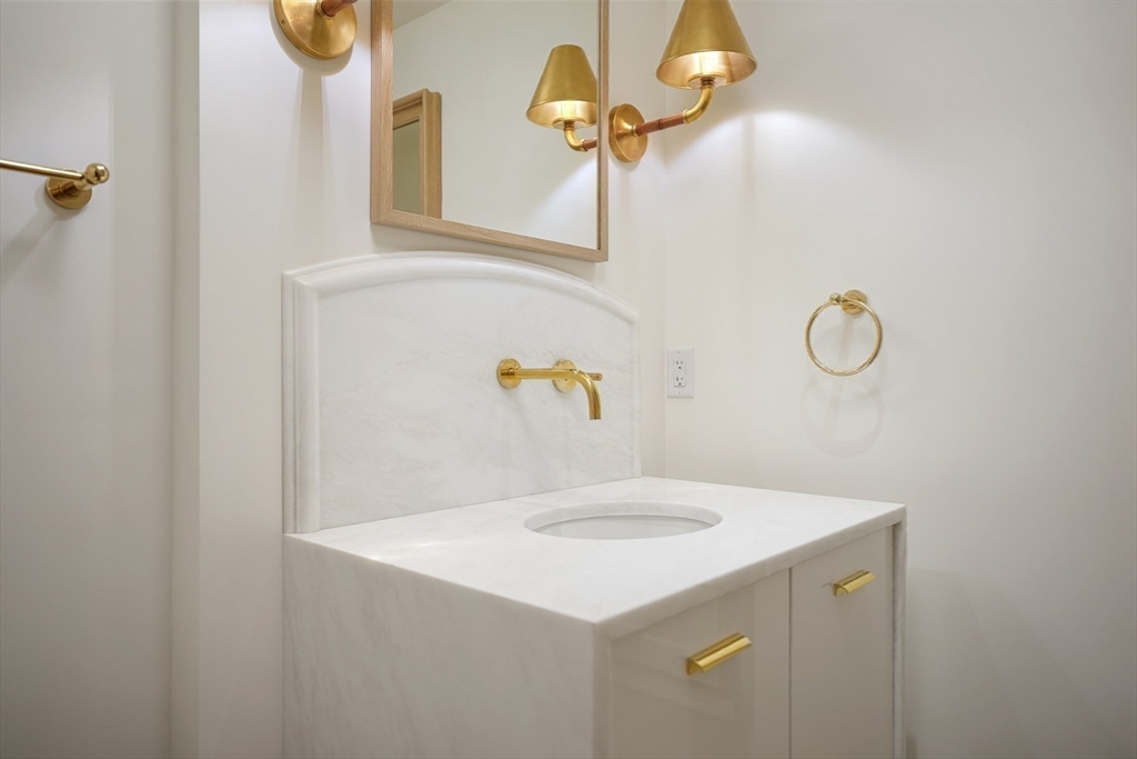 709 Boston Post Road Weston, MA 02493 - Photo 14 of 42 a bathroom with a sink and mirror