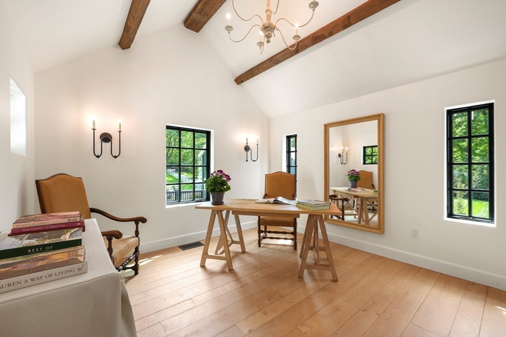 709 Boston Post Road Weston, MA 02493 - Photo 15 of 42 a view of a workspace with furniture and a window