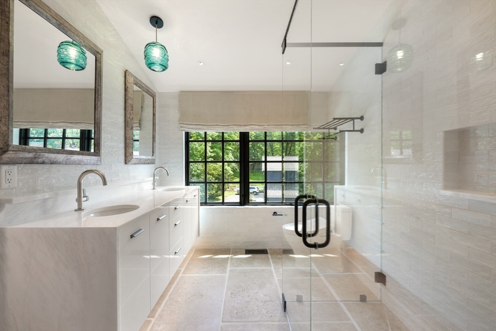 709 Boston Post Road Weston, MA 02493 - Photo 21 of 42 a bathroom with a tub sink and glass door