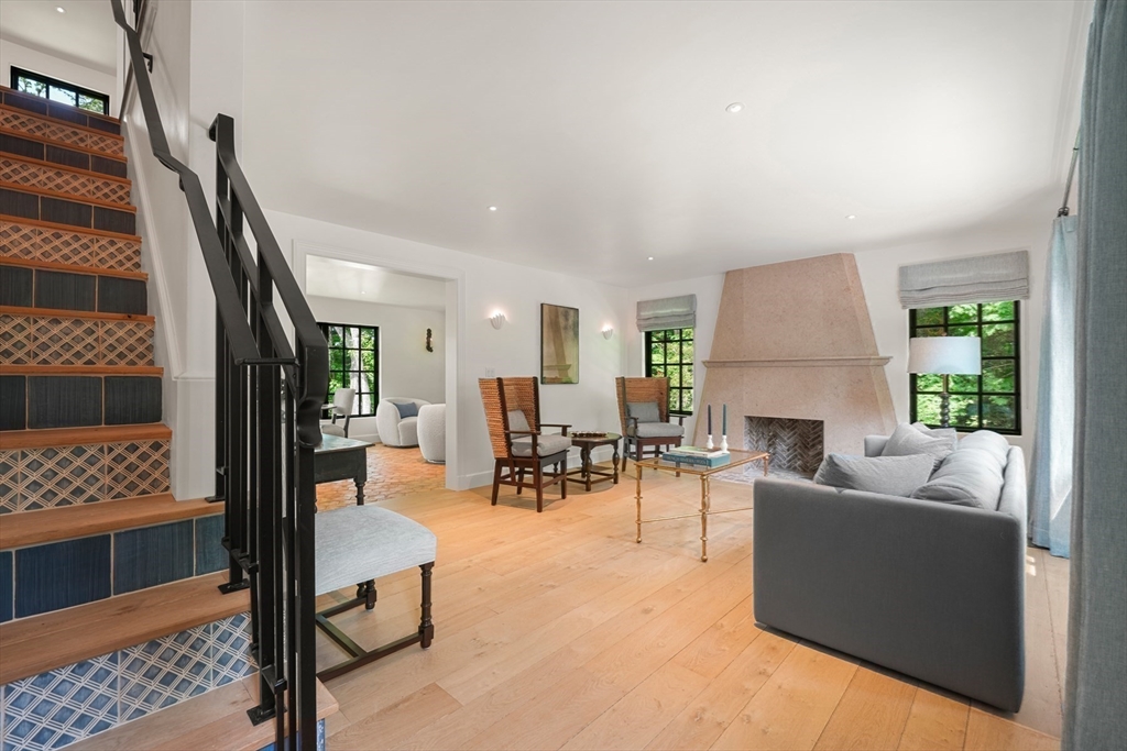 709 Boston Post Road Weston, MA 02493 - Photo 24 of 42 a living room with furniture and a fireplace