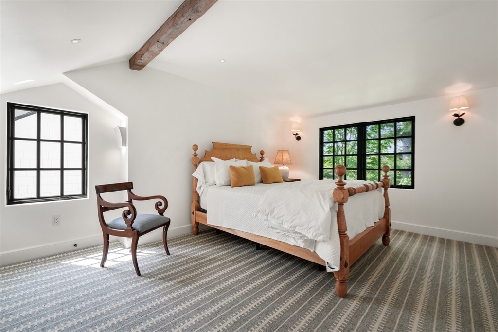 709 Boston Post Road Weston, MA 02493 - Photo 26 of 42 a bedroom with a bed and wooden floor