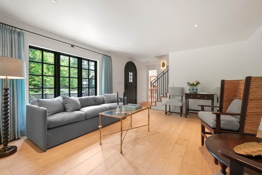 709 Boston Post Road Weston, MA 02493 - Photo 3 of 42 a living room with furniture and a large window