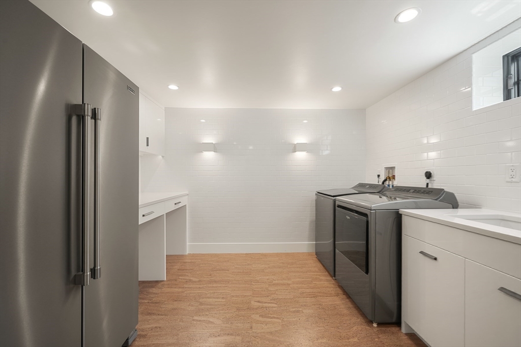709 Boston Post Road Weston, MA 02493 - Photo 31 of 42 a bathroom with a sink and a mirror