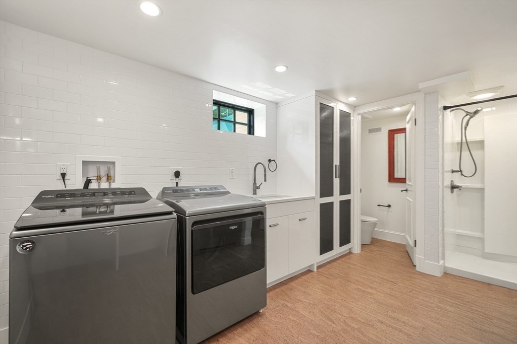 709 Boston Post Road Weston, MA 02493 - Photo 32 of 42 a kitchen with stainless steel appliances granite countertop a stove and a refrigerator
