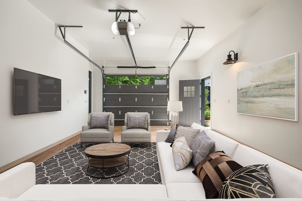 709 Boston Post Road Weston, MA 02493 - Photo 36 of 42 a living room with furniture and a flat screen tv