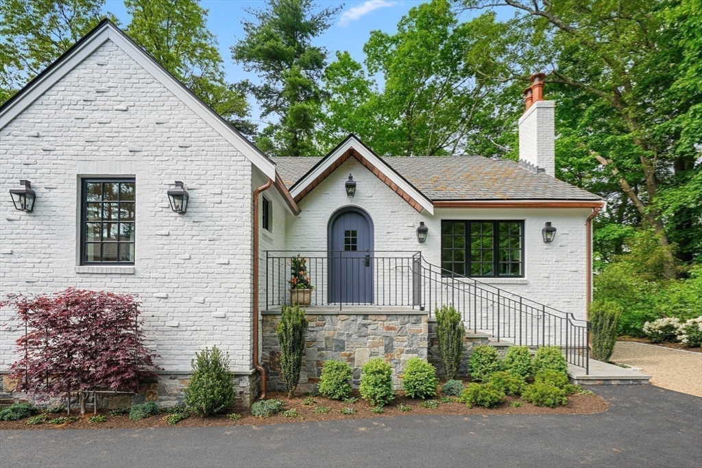 709 Boston Post Road Weston, MA 02493 - Photo 40 of 42 a front view of a house with garden