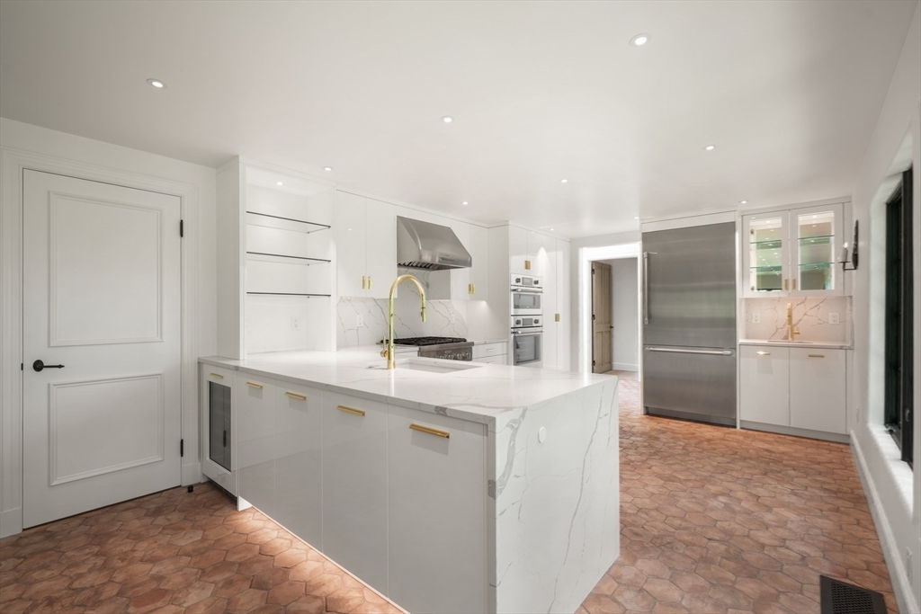 709 Boston Post Road Weston, MA 02493 - Photo 7 of 42 a kitchen with a sink appliances and cabinets