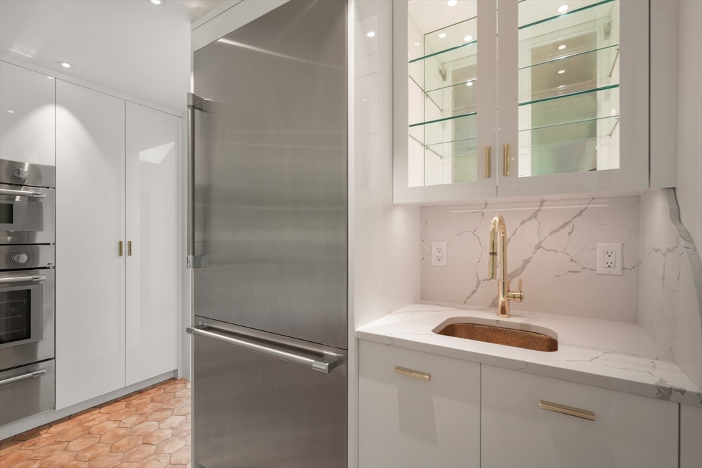 709 Boston Post Road Weston, MA 02493 - Photo 8 of 42 a kitchen with a sink and a refrigerator