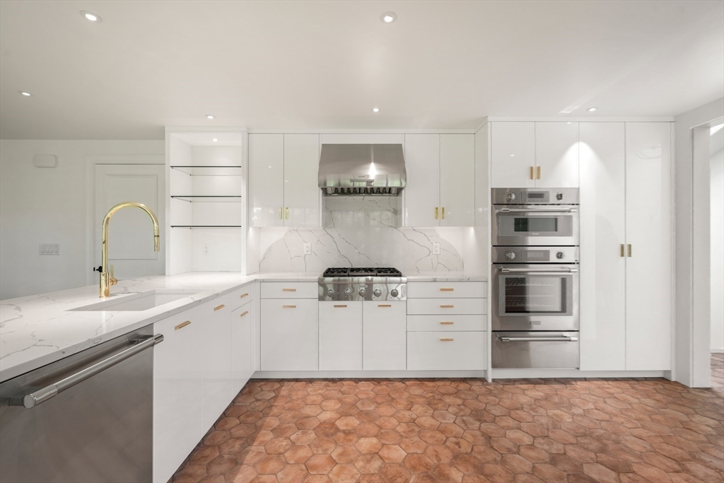 709 Boston Post Road Weston, MA 02493 - Photo 9 of 42 a kitchen with a sink and stainless steel appliances