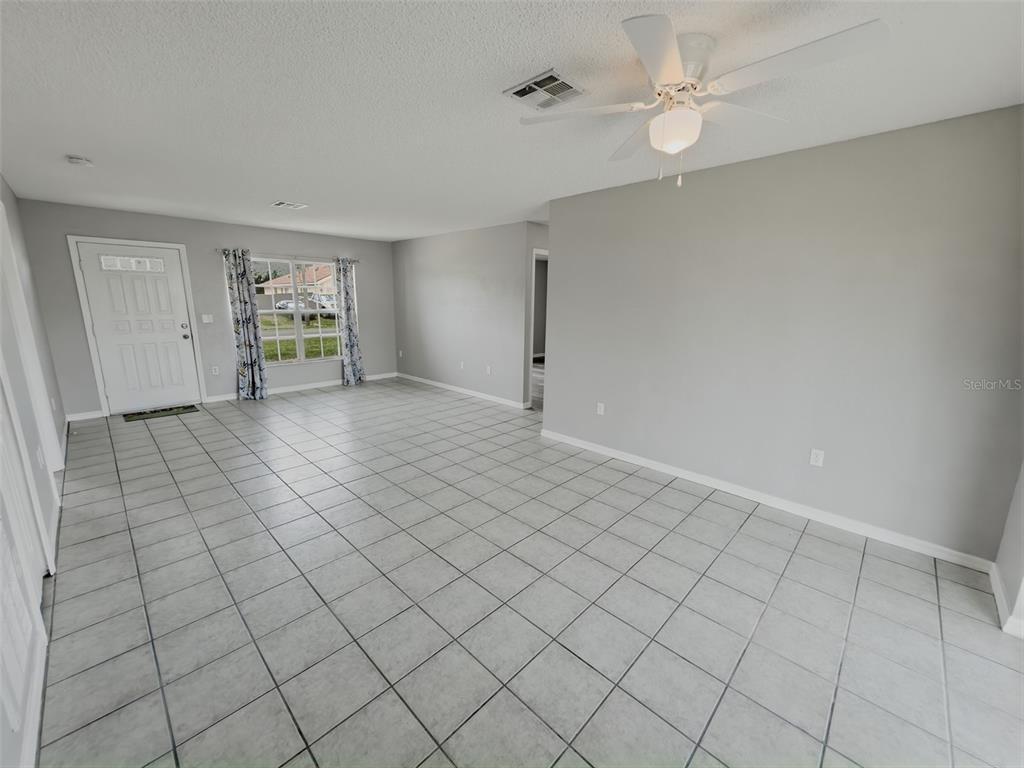 2202 Godfrey Avenue Spring Hill, FL 34609 - Photo 9 of 36 a view of an empty room with a window