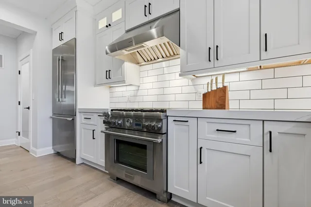 a bathroom with a sink mirror and toilet