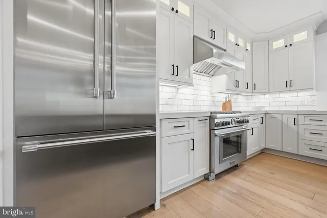 a spacious bedroom with a bed and a ceiling fan