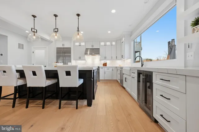a spacious bathroom with a granite countertop sink and a mirror