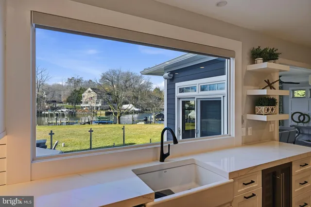 a white tub sitting in a room next to a window