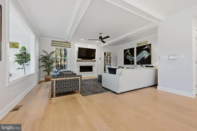 a view of empty room with wooden floor and cabinet