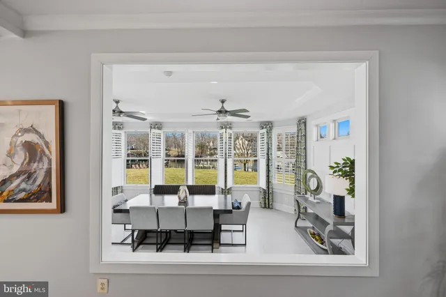 a bedroom with a bed and a ceiling fan