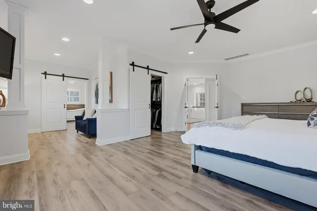 a room with gym equipment and a view of living room