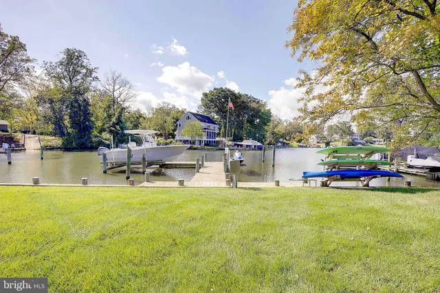 a large kitchen with a table and chairs