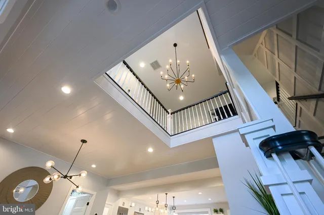 a kitchen with stainless steel appliances and white cabinets