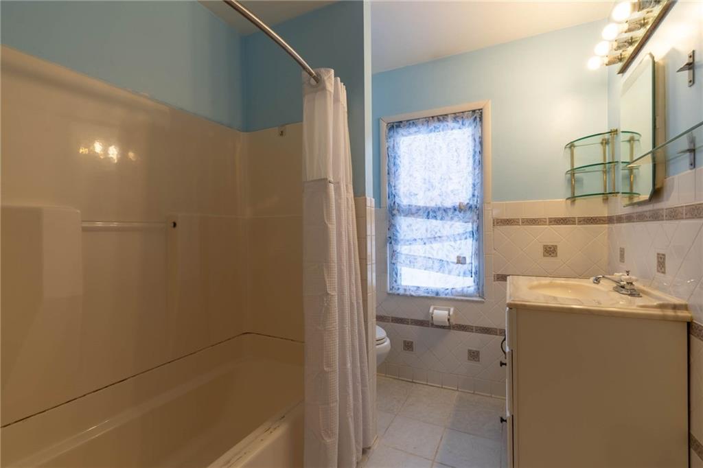 48 Sampson Avenue Pittsburgh, PA 15205 - Photo 11 of 18 a bathroom with a sink and a bathtub