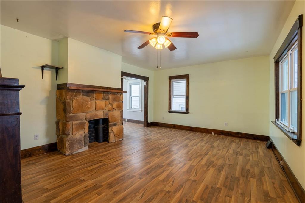 48 Sampson Avenue Pittsburgh, PA 15205 - Photo 4 of 18 a view of an empty room with a fireplace and a window