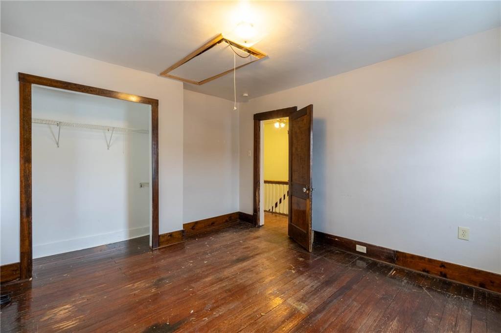 48 Sampson Avenue Pittsburgh, PA 15205 - Photo 10 of 18 an empty room with wooden floor and closet