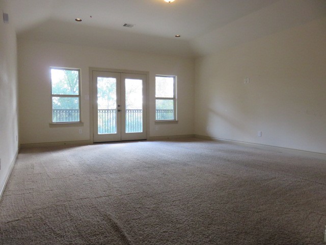 2607 Alan Lake Lane Spring, TX 77388 - Photo 31 of 42 a view of a big room with windows and chandelier fan
