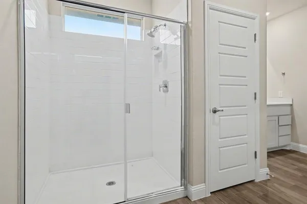 a view of walk in closet with empty racks