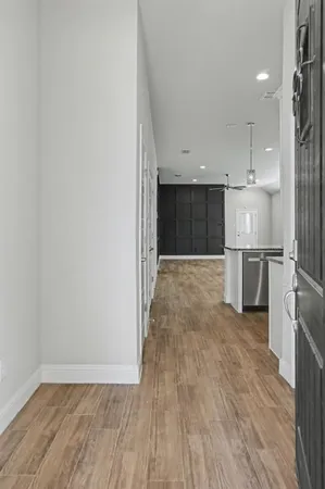a view of a kitchen with a sink and a refrigerator