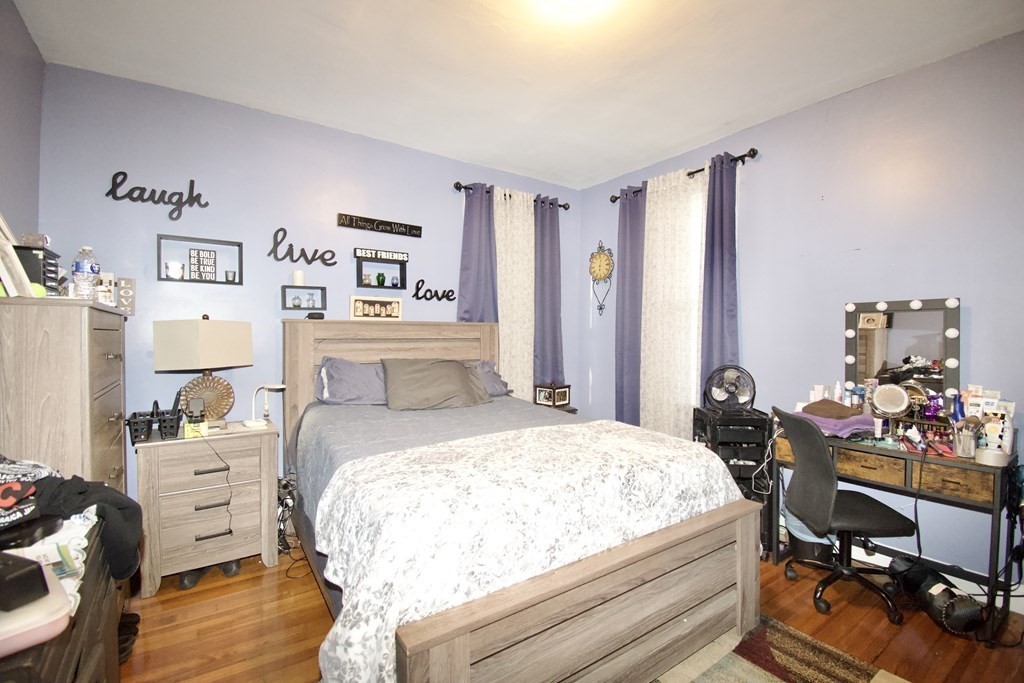 24 Rupert Street Springfield, MA 01108 - Photo 11 of 23 a bedroom with a bed and furniture