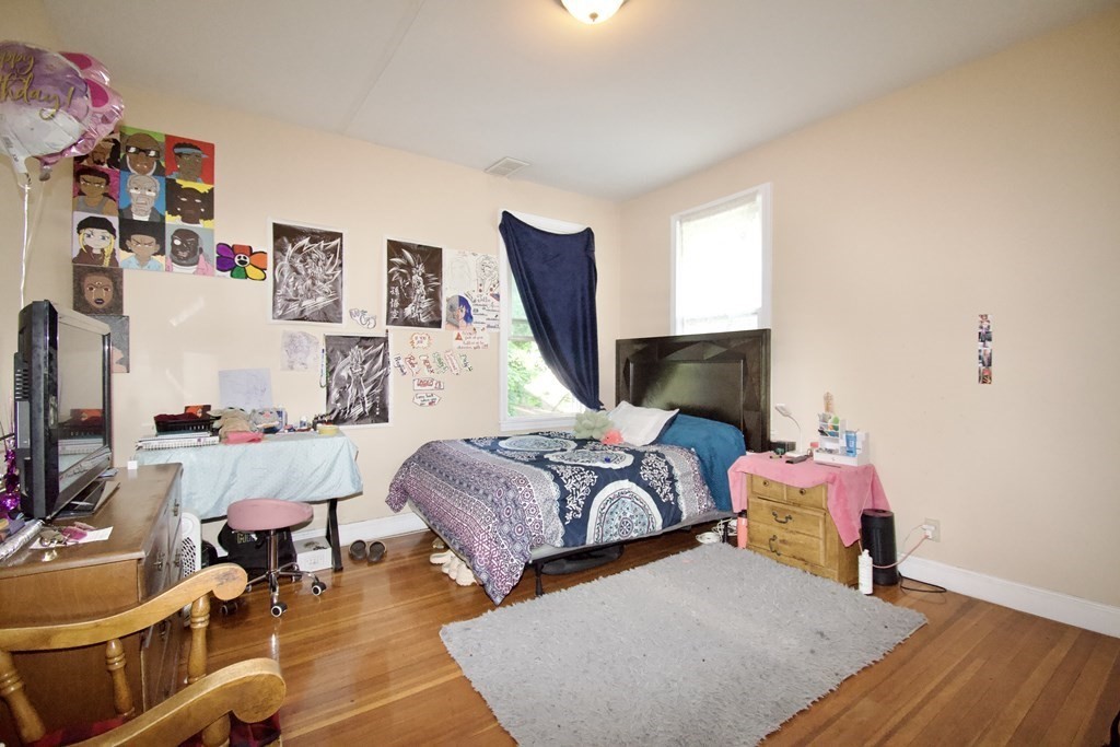 24 Rupert Street Springfield, MA 01108 - Photo 13 of 23 a bedroom with bed and a window