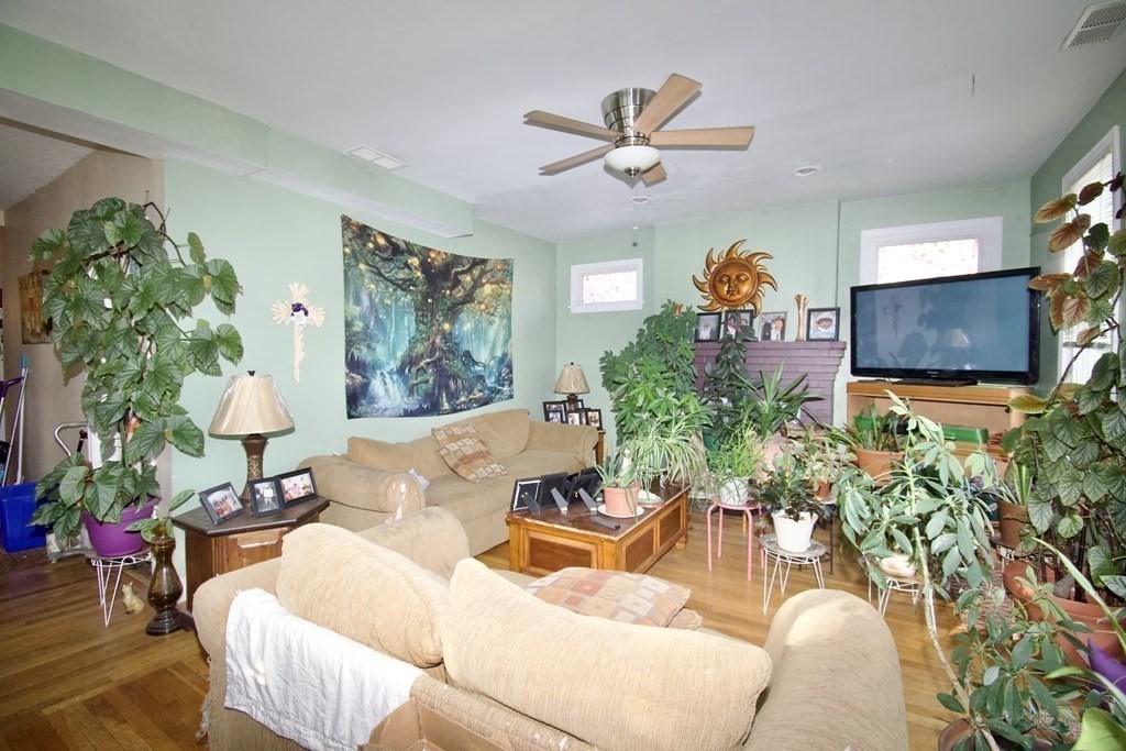 24 Rupert Street Springfield, MA 01108 - Photo 17 of 23 a living room with furniture and a chandelier