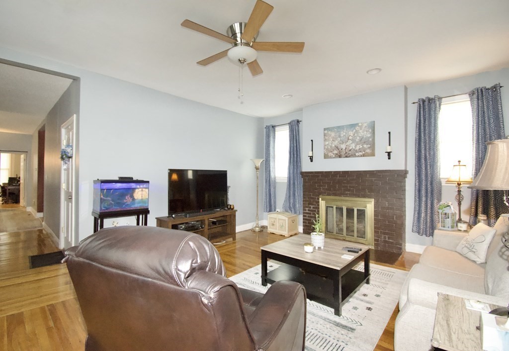 24 Rupert Street Springfield, MA 01108 - Photo 4 of 23 a living room with furniture and a fireplace
