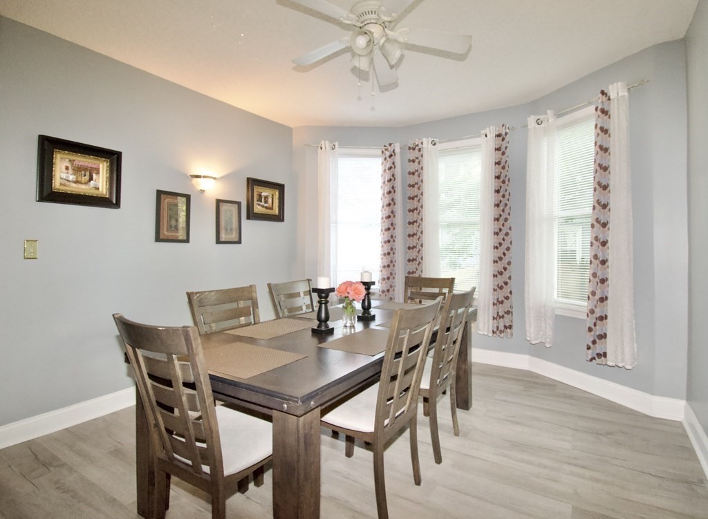 24 Rupert Street Springfield, MA 01108 - Photo 9 of 23 a view of a dining room with furniture and wooden floor