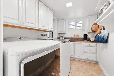 a kitchen with stainless steel appliances granite countertop a stove and a white cabinets