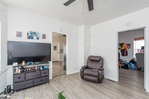 a bedroom with toys and a couch