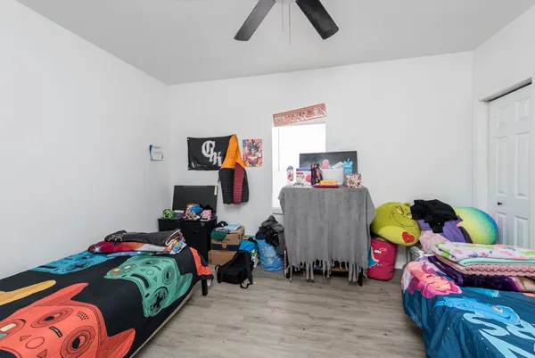 a bedroom with furniture and a bed