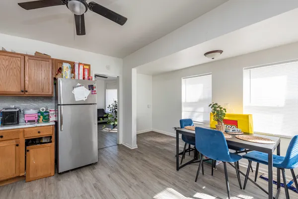 a kitchen with stainless steel appliances a stove refrigerator and microwave