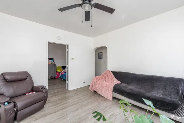 a living room with furniture flowerpot and a window