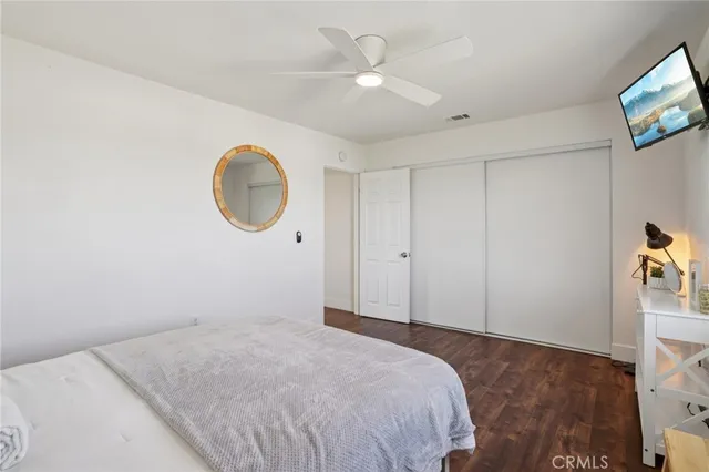 a bedroom with a bed and a table