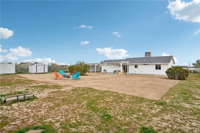 a view of a room with wooden ceiling