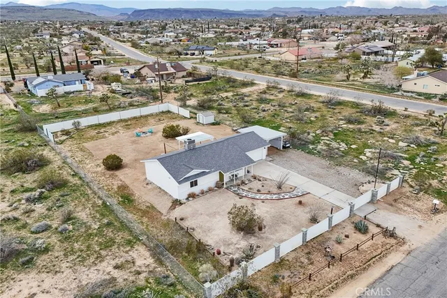 an aerial view of residential houses with outdoor space