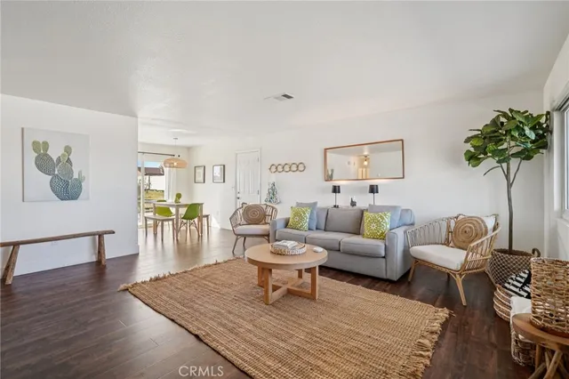 a view of a dining room with furniture and a chandelier