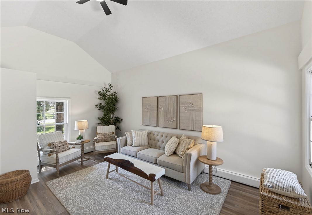 14939 Caves Road Novelty, OH 44072 - Photo 21 of 42 Living room featuring a ceiling fan, lofted ceiling, and dark wood-type flooring